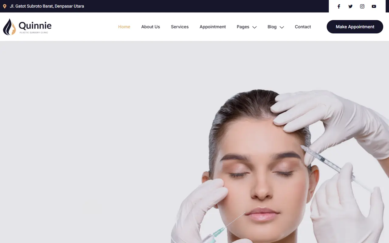 หน้าแรกของธีม Quinnie Plastic Surgery Clinic บนคอมพิวเตอร์